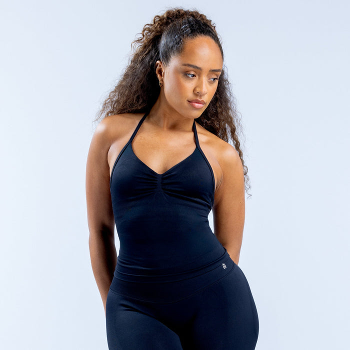 Dark navy longline strappy halter top with ruched center and clean fitted seams.
