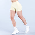 Light yellow 4.5-inch impact shorts with smooth waistband and form-fitting stretch.