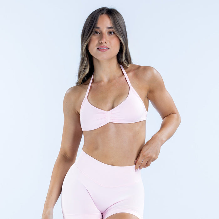 Light pink strappy bra with triangle cups and thin adjustable straps