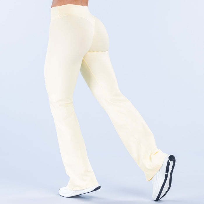 Light cream flare pants, back view, smooth fabric and wide hem