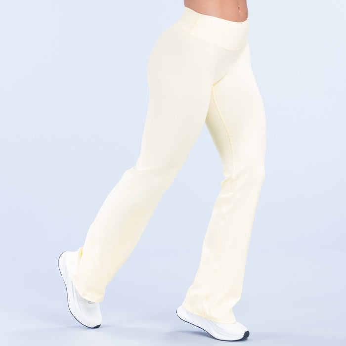 Light cream flare pants, front side view, straight-to-flare leg shape