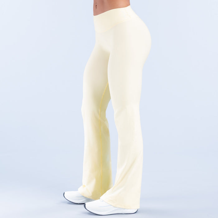 Light cream flare pants, three-quarter view, relaxed waist and wide opening