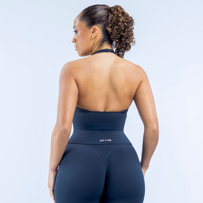 Women's dark navy halter sports top with racerback shown from back