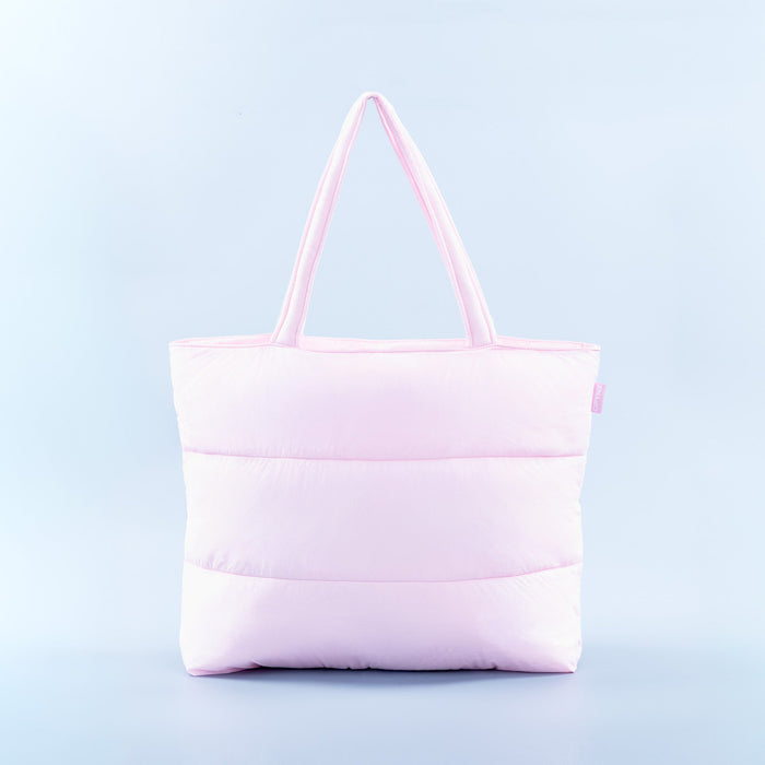 Light pink puffer tote bag with quilted panels and two top handles