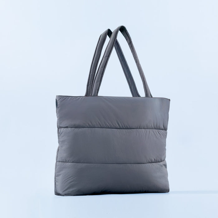 Gray puffer tote bag with two top handles and quilted horizontal baffles
