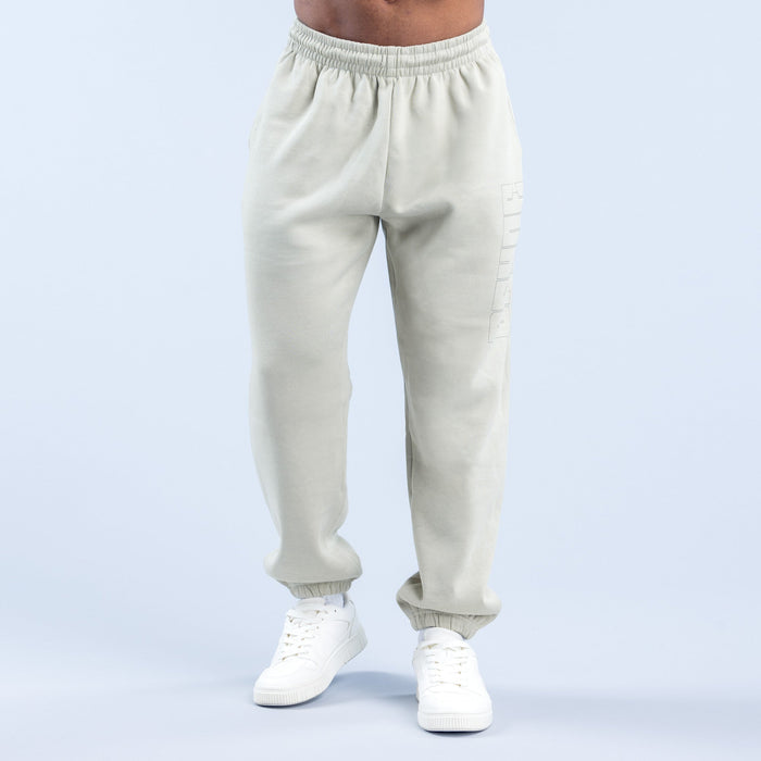 Cream graphic joggers with elastic waistband and ribbed cuffs