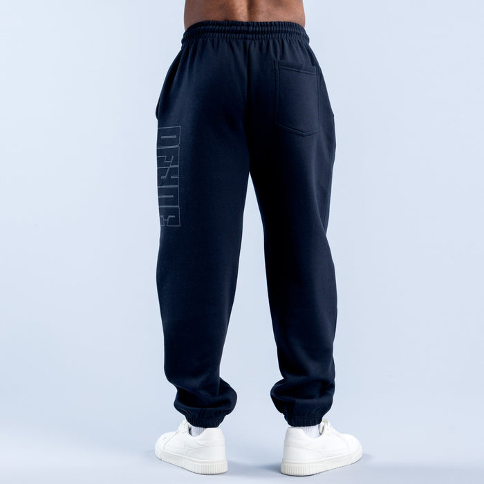 Dark navy joggers with side panel graphic and elastic waistband, tapered leg