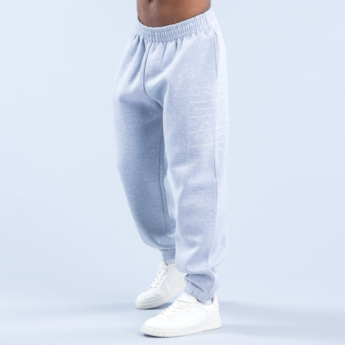 Light blue graphic joggers, rear view, elastic waistband and ribbed cuffs, with white sneakers
