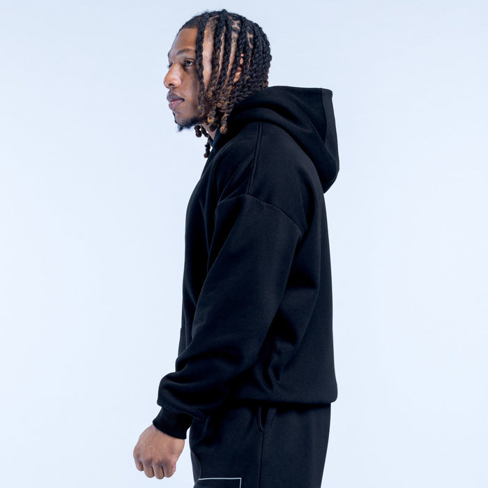 Black pullover hoodie side view with hood, long sleeves, and kangaroo pocket