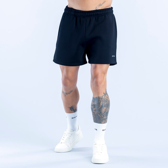 Dark athletic shorts with elastic waistband and small right-leg logo detail.