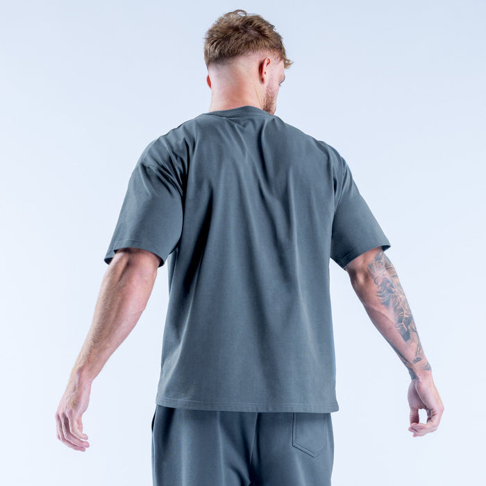 Men's dark teal T-shirt from back view, crew neck, short sleeves, small logo