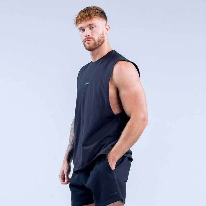 Men's dark sleeveless tank top in side profile, crew neck and small chest logo