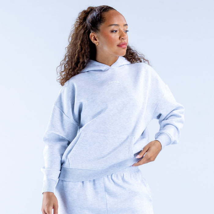 Light blue pullover hoodie with hood and front pocket, three-quarter back view