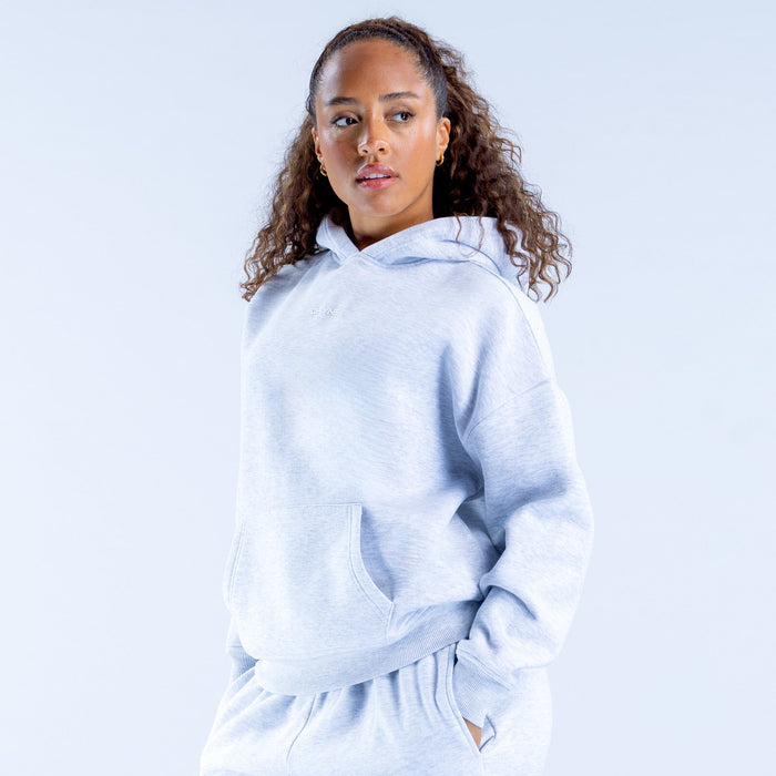 Light blue pullover hoodie with hood and kangaroo pocket, side profile