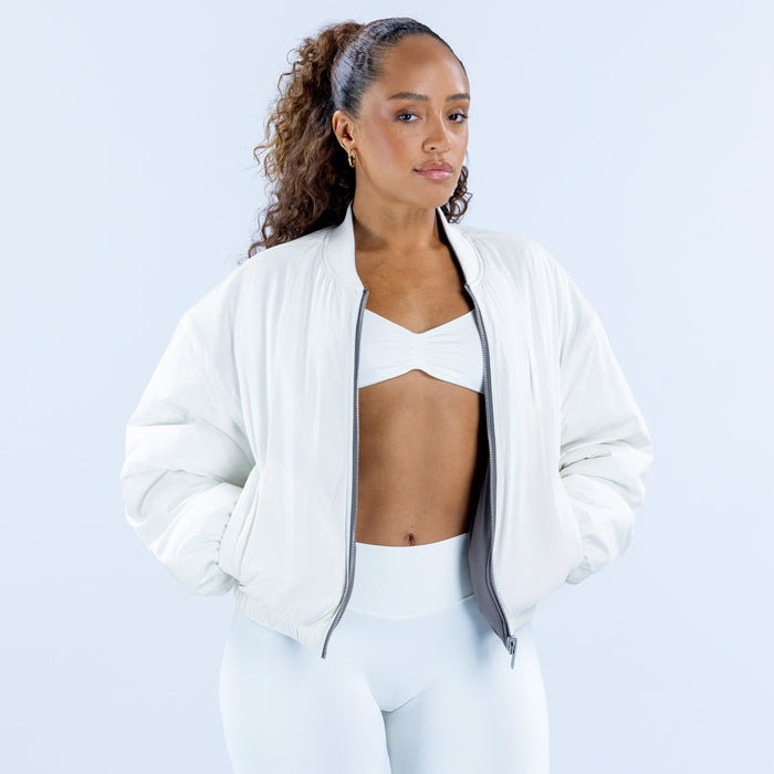 Reversible bomber jacket in white with front zipper and ribbed cuffs