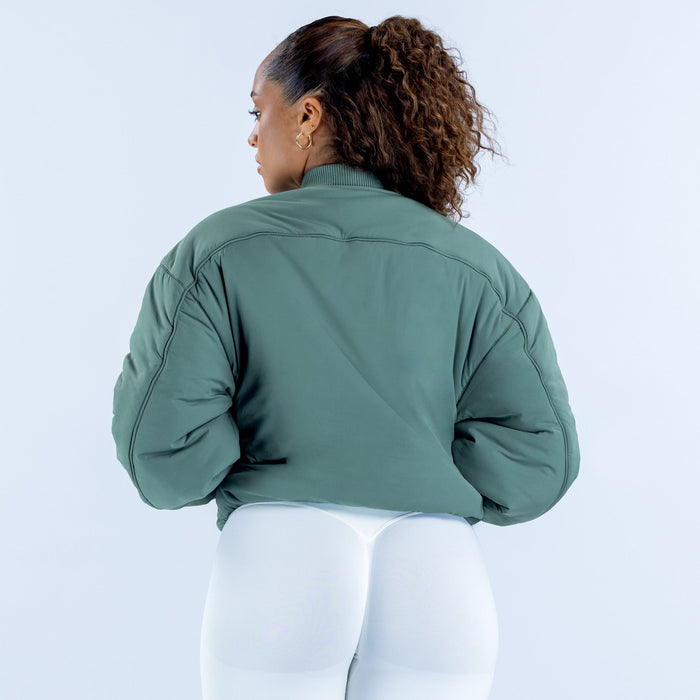 Reversible bomber jacket, green back view with ribbed cuffs and full coverage