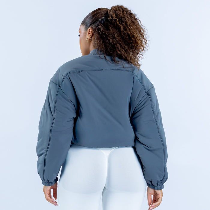 Steel-blue reversible bomber jacket, back view, elastic cuffs and hem