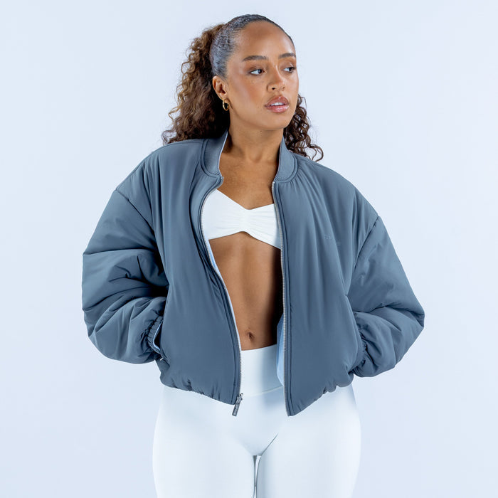 Steel-blue reversible bomber jacket, front view, zip front and stand collar
