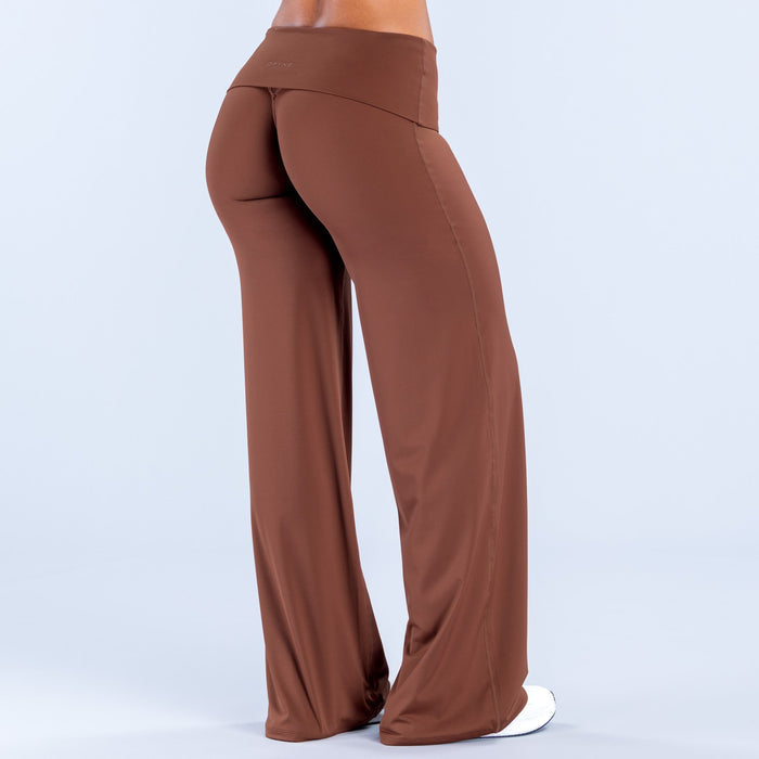 Rust wide-leg pants with fold-over waist, smooth drape and long flared legs
