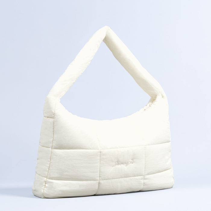 Sav puffer bag in ivory with top handle and quilted panels