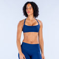 Blue sports bra with scoop neckline and elastic underband.
