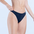 Seamless thong underwear in dark navy, low-rise front with smooth waistband