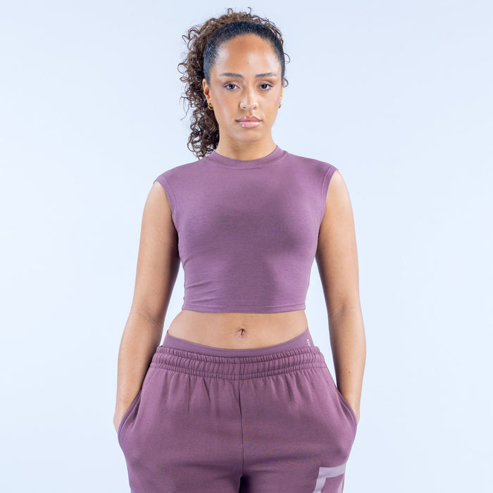 Purple sleeveless crop baby tee with crew neck and small front logo