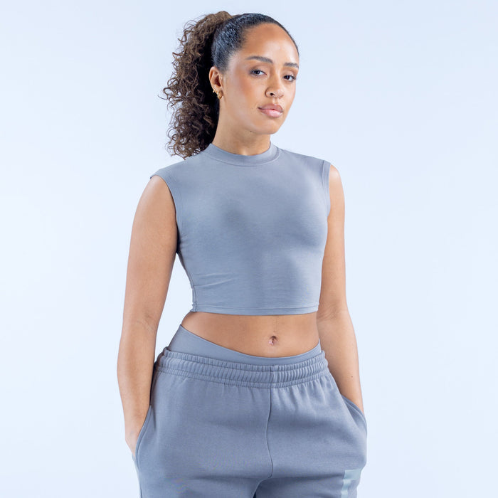 Gray sleeveless cropped baby tee with crew neck and logo at chest