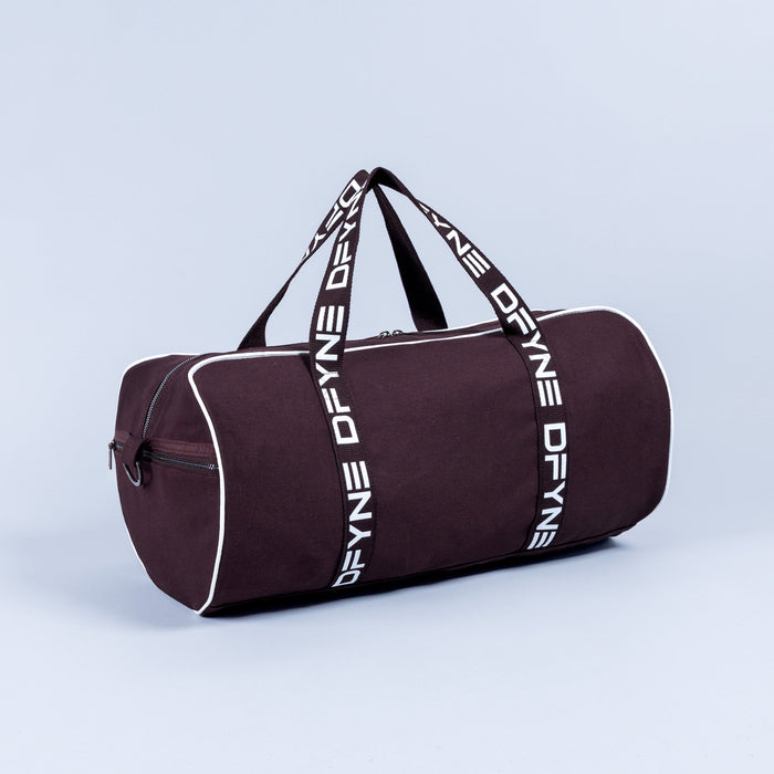 Burgundy duffle bag with white logo webbing straps and front zipper