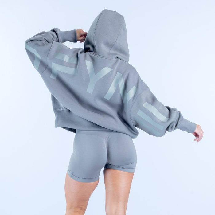 Gray hoodie with large light logo graphic on sleeve, hood with drawstring.