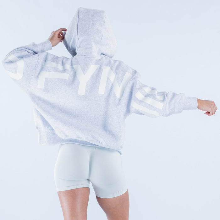 Light blue hoodie with large white back logo text and hood