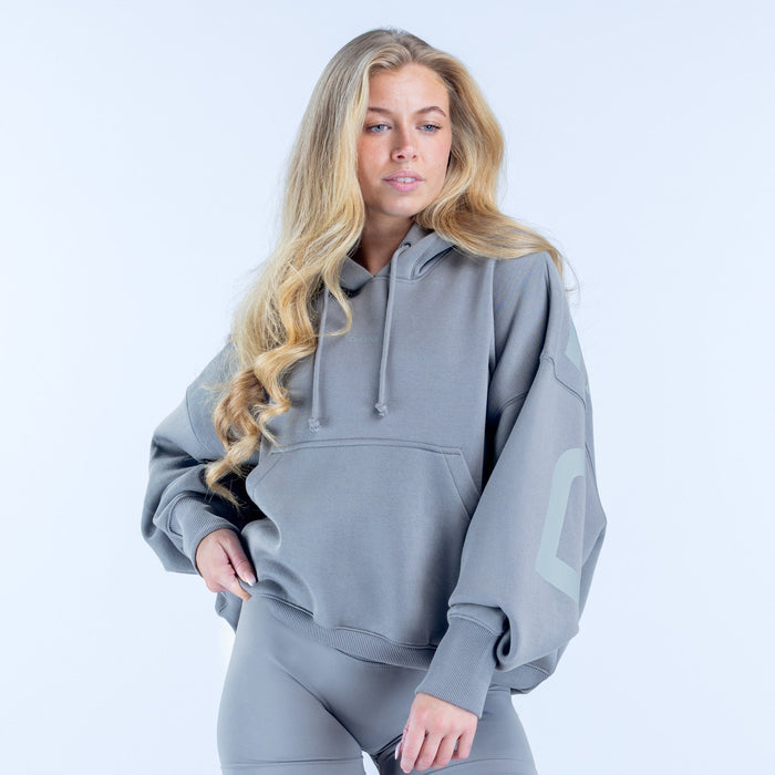 Gray pullover hoodie with hood and drawstring, kangaroo pocket front detail.