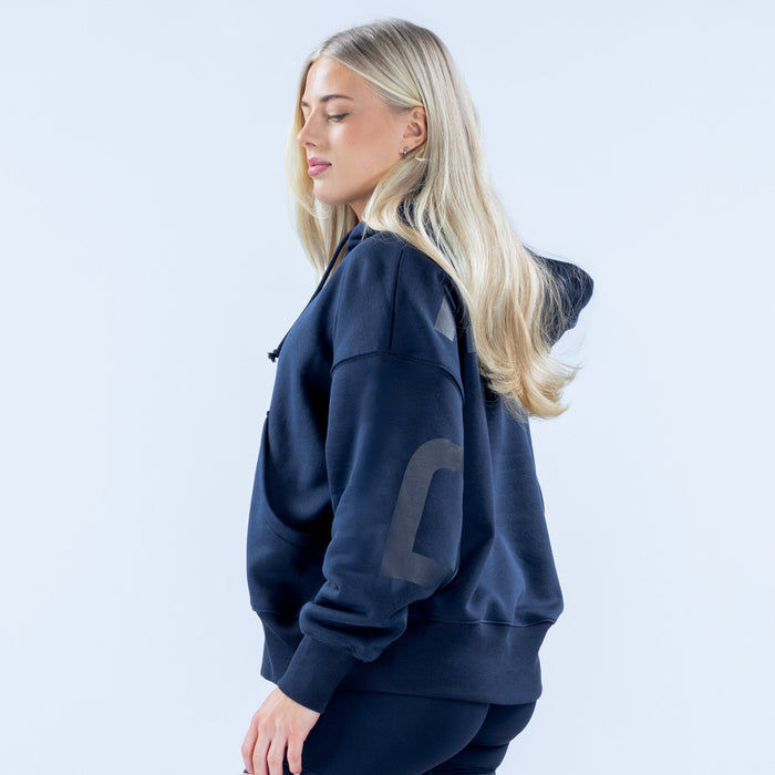 Women's dark navy pullover hoodie with large chest graphic and drawstring hood
