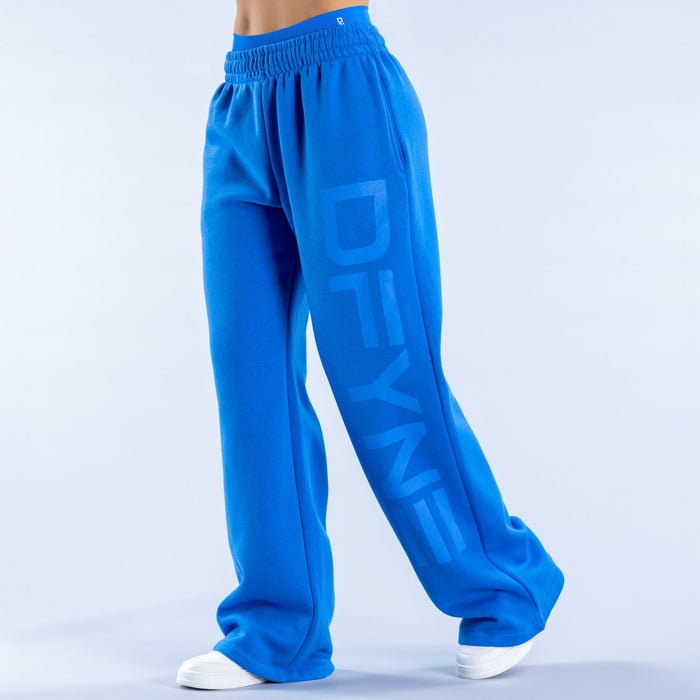 Blue wide-leg jogger pants with elastic waistband and logo graphic on leg