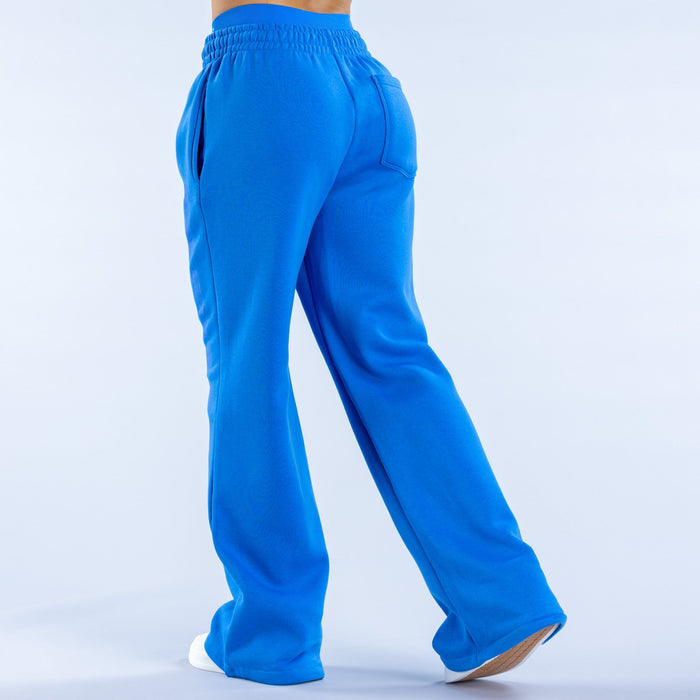 Blue wide-leg joggers, back view, elastic waist and rear pocket detail