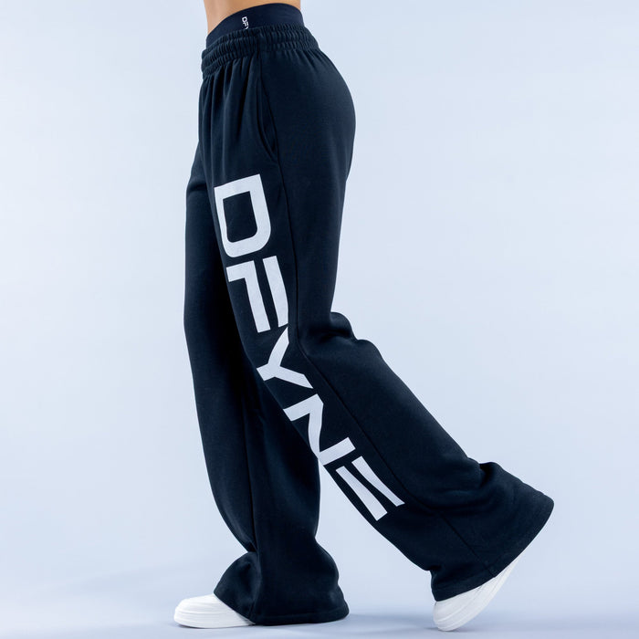Dark navy wide-leg jogger pants with bold white side logo and elastic cuff hem