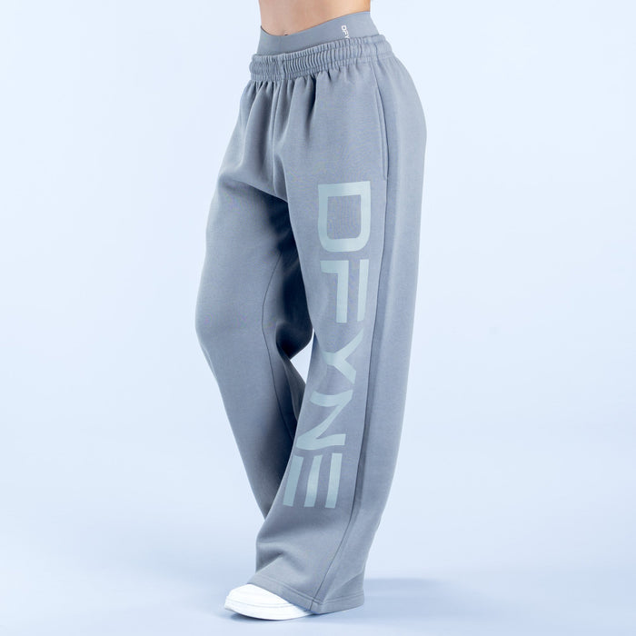 Light gray wide-leg jogger pants with large vertical logo on leg and elastic waist
