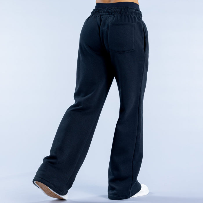 Dark navy wide-leg jogger pants with elastic waist and back pocket detail