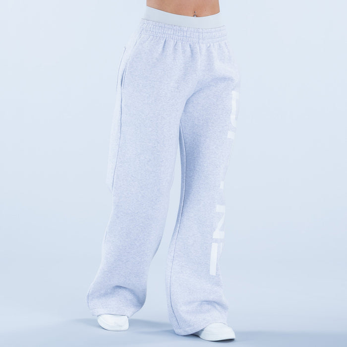 Light blue wide-leg jogger pants with elastic waistband and bold back graphic