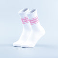 White crew sports socks with pink stripe bands and ribbed cuff