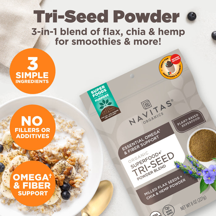 Navitas Organics Tri-Seed Powder Blend package with a bowl of oatmeal and berries on a white background