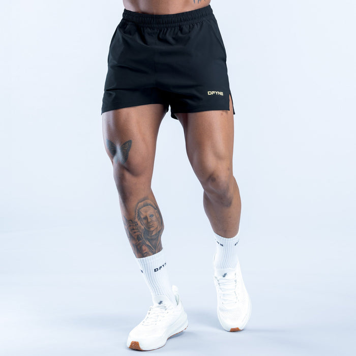 Men's black training shorts with elastic waistband and small side logo
