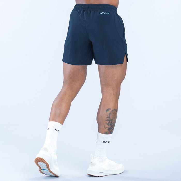 Navy training shorts with elastic waistband and side pocket detail