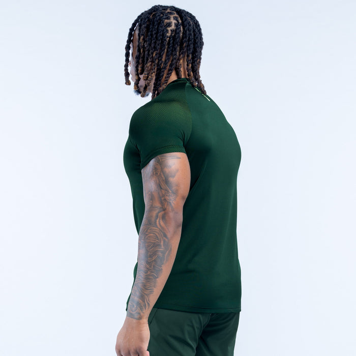 Dark green training t-shirt, short sleeves, side view with small chest logo
