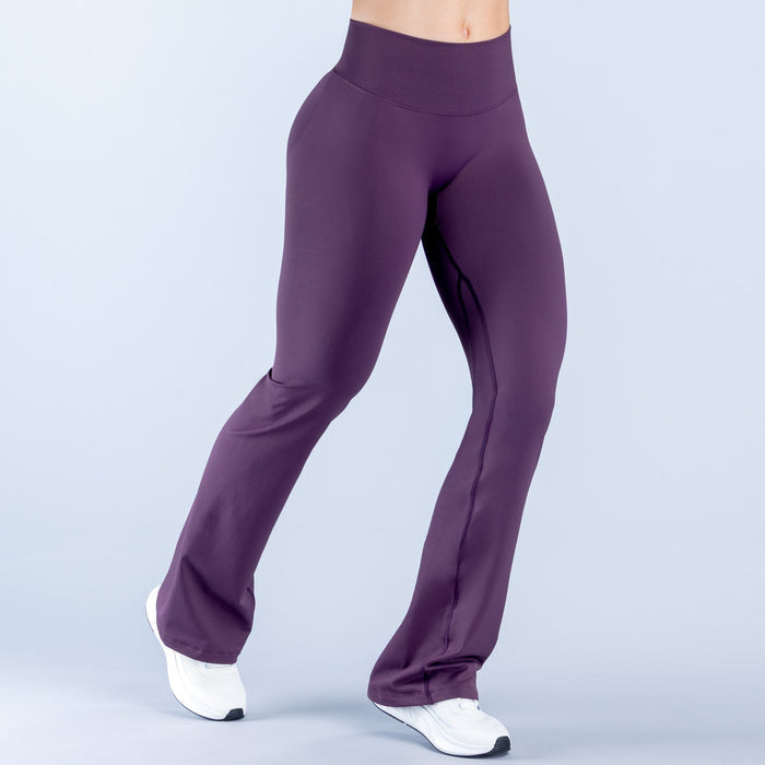 Vision flared leggings, plum purple, straight waistband, wide flared hem.