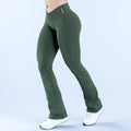 Olive green flare leggings with high-rise waistband and side seams, worn with white sneakers