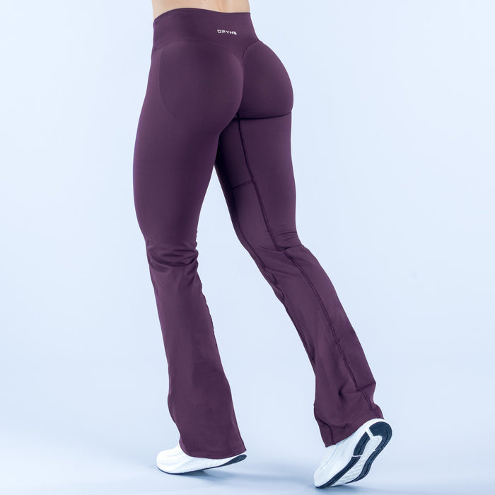 Purple flare leggings with side seam detailing and logo on hip, full length