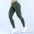 Dark green high-waist leggings with small side logo and ankle length