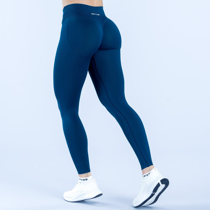 High-waist dark teal leggings, full-length, back view with subtle seams