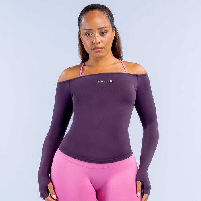 Deep purple off-shoulder long sleeve top with pink shoulder straps and DYFNE logo